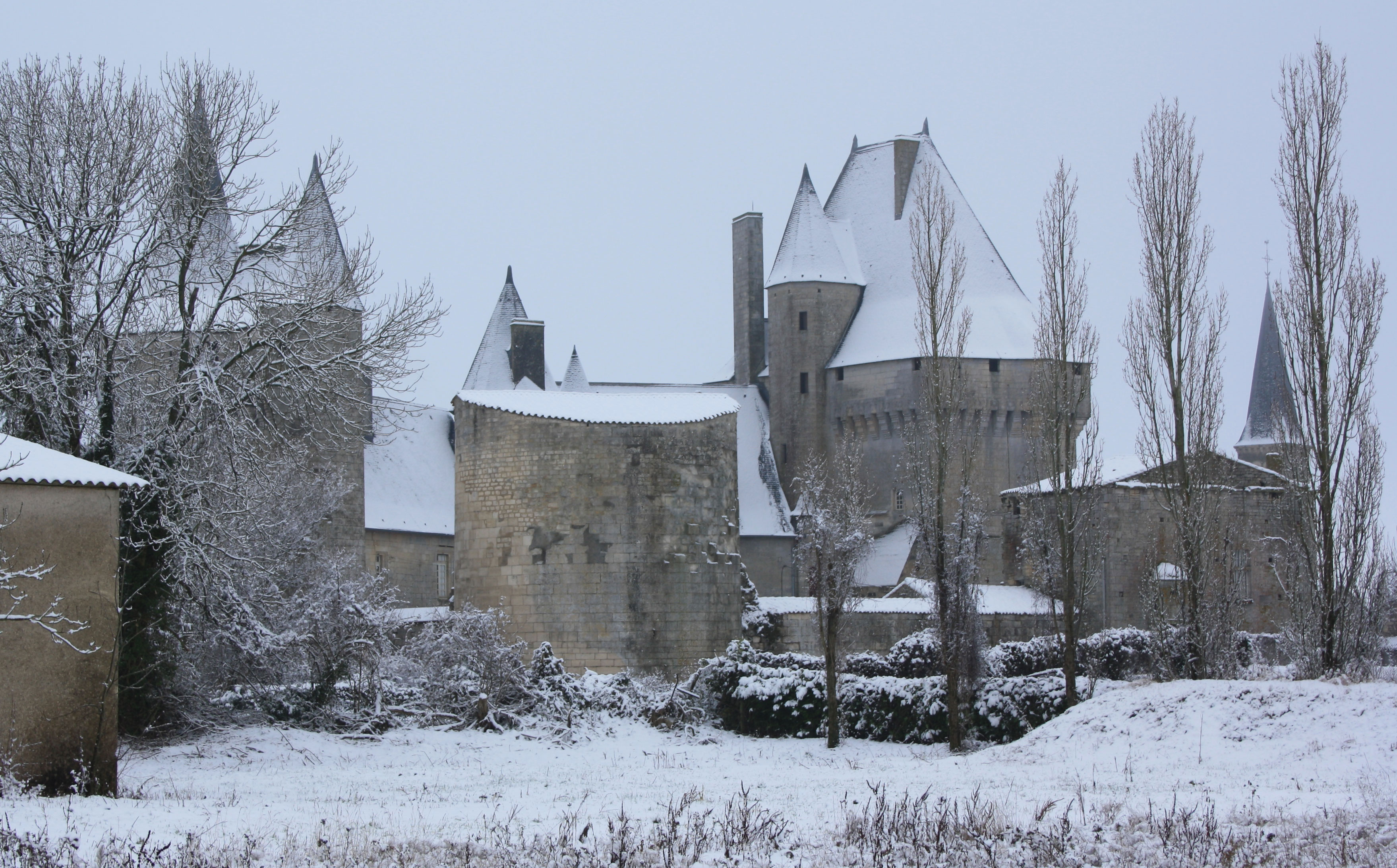 West side of Chateau de Cherveux under snow